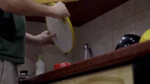 Close up bottom view male hands washing dishes Stock Footage 104460826