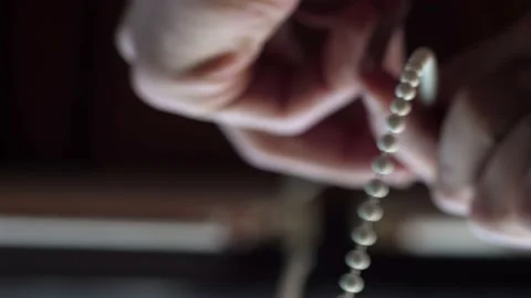 Close-up bottom view of a man's hand that opens the blinds on the window. Stock Footage 239261472