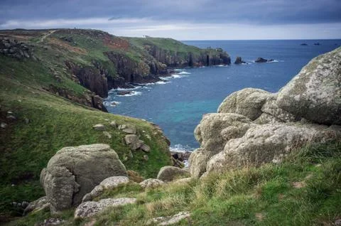 Close up of boulders on the cliffs Lands End Cornwall Stock Photos