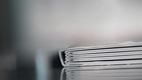 Close up of bound pages on binding press in printing plant production process Stock Footage 323390027