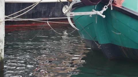Close-up of the bow of a green large sailing boat with an anchor Stock Footage 258550776