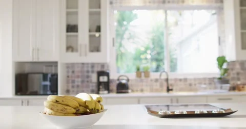 Close up of bowl of bananas lying on table in kitchen Stock Footage 337025094