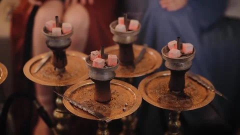 Close-up of a bowl of hookah, with burning coals on it. Smoking shisha. Heated Stock Footage 234754296