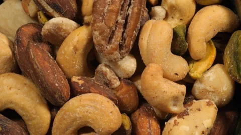 Close up of a bowl of mixed nuts Stock Footage 131983544
