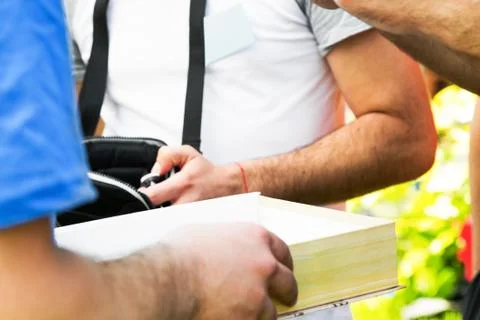 Close up on box in hands of person Stock Photos
