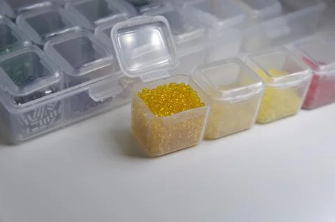 Close up box with yellow beads Stock Photos