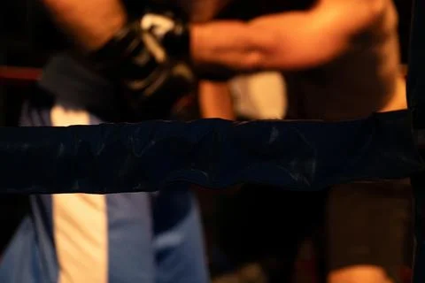 A close-up of boxers fighting in a boxing ring during a fight Stock Photos