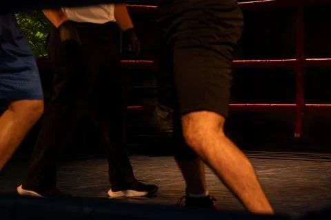 A close-up of boxers fighting in a boxing ring during a fight Stock Photos