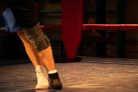 A close-up of a boxer's legs in a boxing ring during a fight Stock Photos