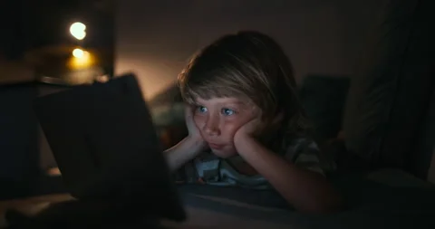 Close up of boy 4-5 years child while using a tablet Concept, kid dream online Stock Footage 224300527