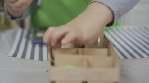 Close up. Boy chose an egg from basket with eggs Stock Footage 127964001