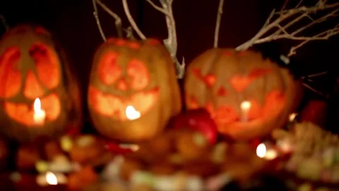 Close up of boy drawing on pumpkin, decoration for Halloween season. Woman .. Stock Footage 272459909