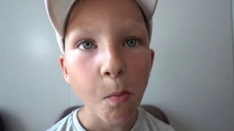 Close up Boy eat Pie and looks to a Camera Stock Footage 77210264