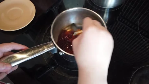 Close-up Boy Hands cooking sauce. Sauce prepairing. Chef Preparing food Stock Footage 152103535