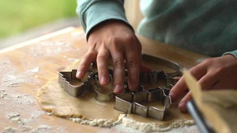 Close-up of boy is hands preparing gingerbread dough using New Year Stock Footage 293747110