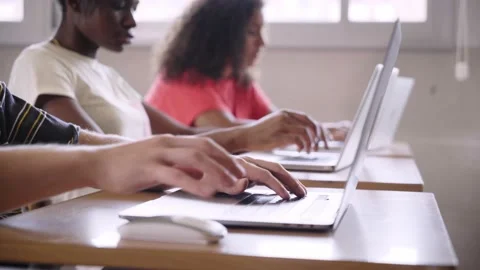 Close up of boy hands typing on laptop in classroom. Generation z and study Stock Footage 239472108