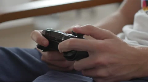 Close up of boy hands using game controller, in the end throwing the controller Stock Footage 68204616