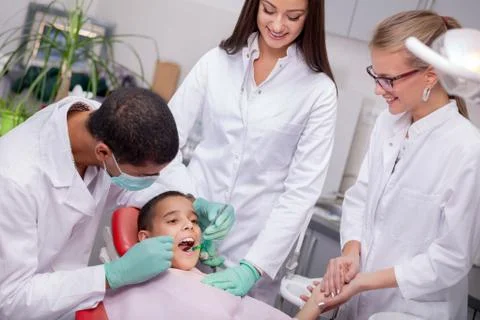 Close up of boy having his teeth examined by a dentist Stock Photos