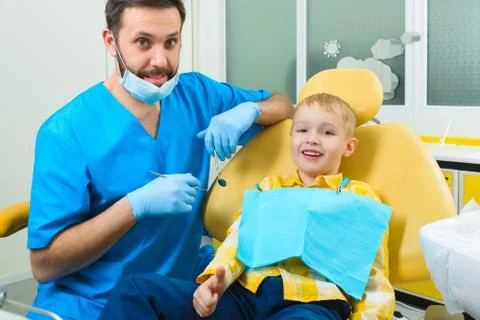 Close up of boy having his teeth examined by a dentist Stock Photos