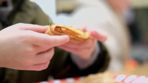 Close up of boy holding pancake Stock Footage 303717545