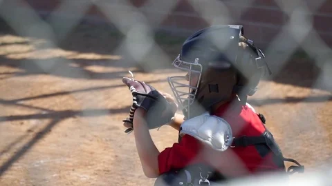 Close-up of a boy playing catcher for a little league baseball team. Stock Footage 70435121