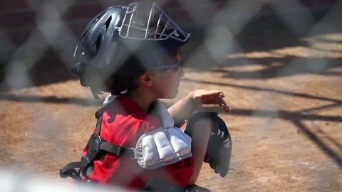 Close-up of a boy playing catcher for a little league baseball team. Stock Footage 71291983