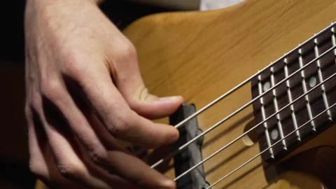 Close-up of a boy playing an electric guitar Stock Footage 228997066