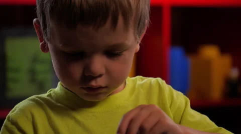 Close up of boy playing with Lego building blocks #2 Vídeos de archivo 63397402