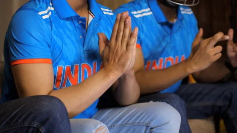 Close-up of a boy praying for Indian cricket team to win, praying with folded... 스톡 동영상 253140444