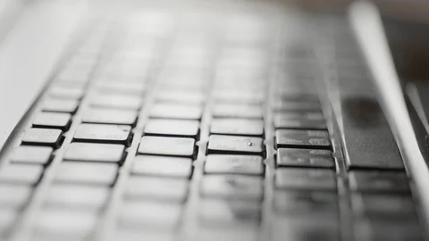 Close-up a boy prints text on the laptop keyboard at home Stock Footage 129877219