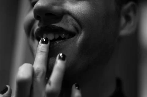 Close-up of a boy putting on lipstick 库存照片