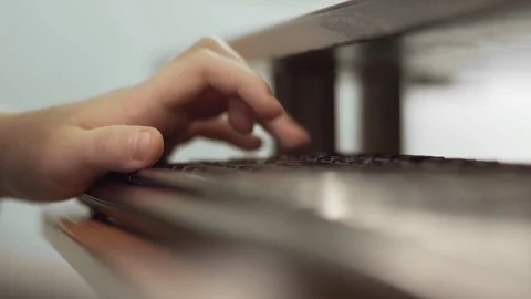 Close Up Of Boy s Hand Using Computer Keyboard Video stock 99079326