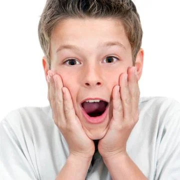 Close up of boy with surprising face expression. Stock Photos