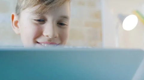 Close- up of a boy who sees something on the tablet Stock Footage 62066471