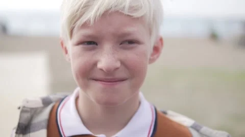 A close-up of the boy's face is blonde Stock Footage 224741567