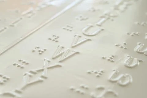 Close-up of a braille decoder with the English alphabet. 스톡 사진