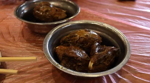 Close up of braised rabbit head, a famous dish in Shuangliu, Chengdu, China Stock Footage 49089890