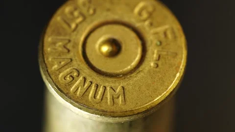 Close up of a brass bullet casing with 357 magnum markings showing details Stock Footage 328579604
