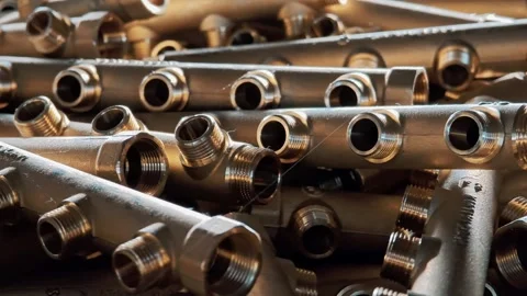 Close up of brass distribution manifolds for heating systems. Plumbing parts Stock Footage 329263268