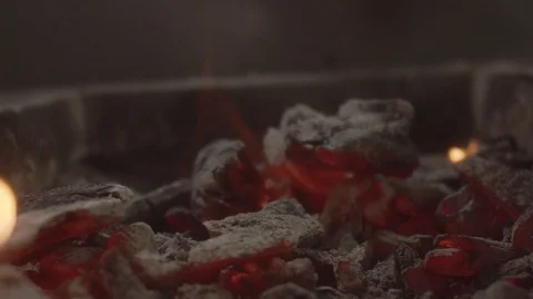 Close-up on brazier with hot coals placed on skewer kebab. Slow motion video Stock Footage 114552035