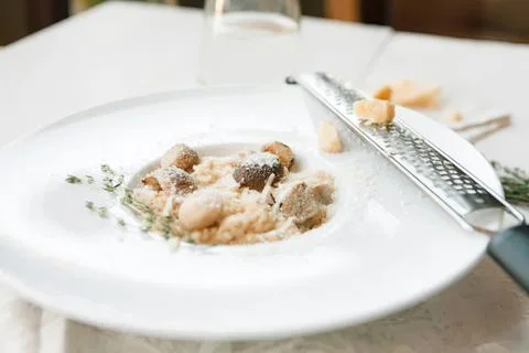 Close-up of bread and butter on a white plate with knife Stock Photos