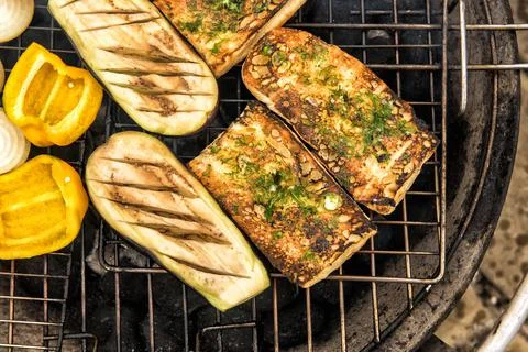 Close up of bread and vegetables on grill Stock Photos
