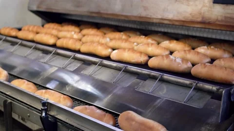 Close up on bread being prepared in the production factory. Food manufacturin Stock Footage 222403372