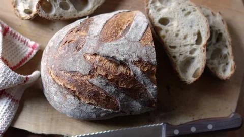 Close Up Of Bread On A Cutting Board Stock Footage 128675702