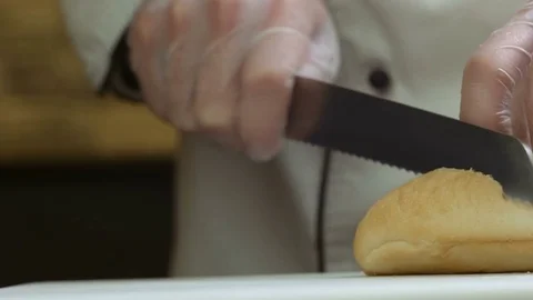 Close-up of bread cutting for a bruschette Stock Footage