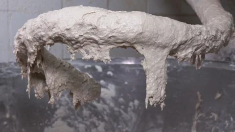 Close-Up of Bread Dough on Industrial Mixer Hook Video stock 346308355