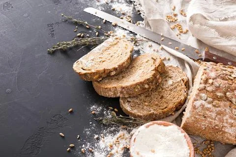 Close-up of bread slices with butter on a rustic table Stock Photos
