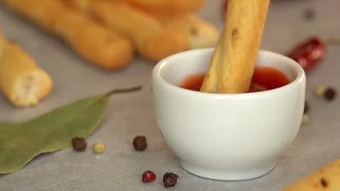 Close up of bread stick dips in ketchup sauce. Food. Fast food Stock Footage 309205591