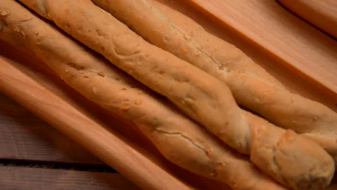 Close Up of Bread Sticks on Cutting Board Stock Footage 273710369