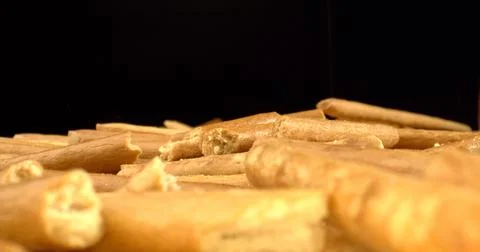 Close-up of breadsticks texture on dark background. Pretzel Sticks. Bread Straw Stock Photos